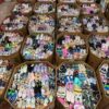 Pallet of assorted brand-new kids’ shoes in various styles, sizes, and colors – includes sneakers, boots, and sandals