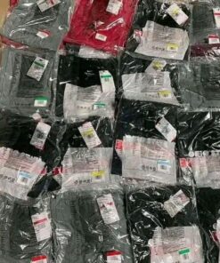 Pallet of assorted wholesale T-shirts in various colors and sizes, shrink-wrapped for bulk liquidation sale