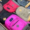 Wholesale pallet of assorted school backpacks in various colors and styles, ideal for retailers or bulk buyers