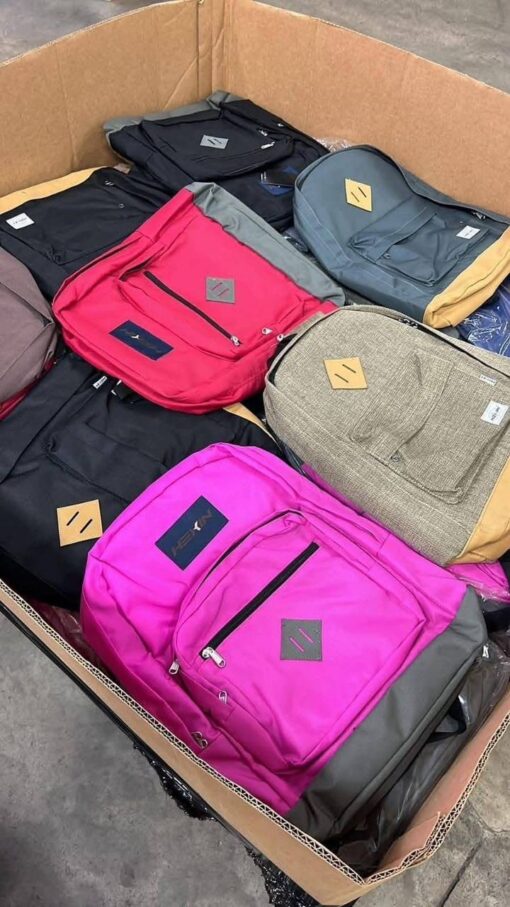 Wholesale pallet of assorted school backpacks in various colors and styles, ideal for retailers or bulk buyers
